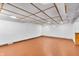 A spacious basement with recessed lighting, drop ceiling, a small window, and paneled accent walls at 1107 N Hartman Dr, Indianapolis, IN 46219