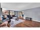 Inviting living room with hardwood floors, a comfortable sectional sofa, and neutral-toned walls at 1107 N Hartman Dr, Indianapolis, IN 46219