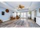 This basement features hardwood floors, modern lighting, and a door to a private patio at 11319 Shoreview Ln, Indianapolis, IN 46236