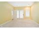 This bedroom includes carpet flooring, neutral walls, a ceiling fan, and a private ensuite at 11319 Shoreview Ln, Indianapolis, IN 46236