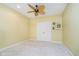 This bedroom features neutral walls, a ceiling fan, carpet flooring, and closet space at 11319 Shoreview Ln, Indianapolis, IN 46236