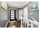 Inviting foyer showcasing dark hardwood floors, neutral walls, and elegant white trim at 11319 Shoreview Ln, Indianapolis, IN 46236