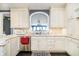 Kitchen showcasing custom cabinetry, granite countertops, a stainless steel sink, and stylish backsplash at 11319 Shoreview Ln, Indianapolis, IN 46236