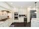 Modern kitchen featuring custom cabinetry, granite countertops, and stainless steel appliances, perfect for cooking at 11319 Shoreview Ln, Indianapolis, IN 46236
