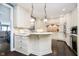 Gourmet kitchen with custom cabinetry, granite countertops, and stainless steel appliances at 11319 Shoreview Ln, Indianapolis, IN 46236