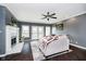 Cozy living room features a fireplace, fan, sliding glass doors and comfortable seating area at 11319 Shoreview Ln, Indianapolis, IN 46236
