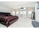 Bright main bedroom with vaulted ceiling, ample natural light, carpeted floors, and access to balcony at 11319 Shoreview Ln, Indianapolis, IN 46236