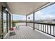 This patio boasts views of the lake, outdoor seating, and a ceiling to provide shade at 11319 Shoreview Ln, Indianapolis, IN 46236