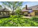 Lush backyard featuring a gazebo, mature trees, and a well-maintained lawn at 11471 Clarkston Rd, Zionsville, IN 46077