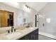 Modern bathroom featuring a double sink vanity, framed mirror, and walk-in shower with glass door at 11471 Clarkston Rd, Zionsville, IN 46077