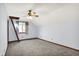 Bright bedroom with neutral carpeting, a ceiling fan, and a window that lets in natural light at 11471 Clarkston Rd, Zionsville, IN 46077