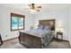 Bedroom with a ceiling fan, a window and a large bed at 11471 Clarkston Rd, Zionsville, IN 46077