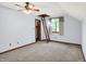 Bright bedroom featuring neutral carpeting, a ceiling fan, and natural light at 11471 Clarkston Rd, Zionsville, IN 46077