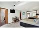 Bright bedroom with a large bed, neutral decor, and en suite bathroom at 11471 Clarkston Rd, Zionsville, IN 46077