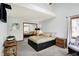 Bright bedroom with a large bed, neutral decor, and natural light from window view at 11471 Clarkston Rd, Zionsville, IN 46077