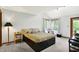 Bright bedroom with a large bed, neutral decor, and natural light from multiple windows at 11471 Clarkston Rd, Zionsville, IN 46077