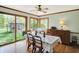 Bright dining room with large windows overlooking the backyard and outdoor gazebo at 11471 Clarkston Rd, Zionsville, IN 46077