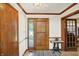 Entryway featuring tile floors, a decorative front door, and decorative lighting fixture at 11471 Clarkston Rd, Zionsville, IN 46077