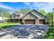 This stunning home boasts an attached three car garage and a large driveway at 11471 Clarkston Rd, Zionsville, IN 46077