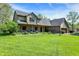 Home featuring a well manicured lawn and covered front porch with sitting area at 11471 Clarkston Rd, Zionsville, IN 46077