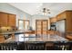 Spacious kitchen features hardwood floors, granite counters, and stainless steel appliances at 11471 Clarkston Rd, Zionsville, IN 46077