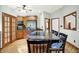 Open kitchen with granite countertops, stainless steel appliances, wooden cabinets and long breakfast bar at 11471 Clarkston Rd, Zionsville, IN 46077