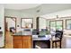Open kitchen with granite countertops, stainless steel stove, wooden cabinets and wood flooring at 11471 Clarkston Rd, Zionsville, IN 46077