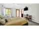 Bright main bedroom boasts vaulted ceiling, accent furniture, and a door to the backyard at 11471 Clarkston Rd, Zionsville, IN 46077