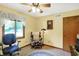 Small office space with natural light, a comfortable chair, and neutral paint at 11471 Clarkston Rd, Zionsville, IN 46077