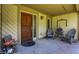 Covered entryway with room for seating and a well decorated space to greet guests at 11471 Clarkston Rd, Zionsville, IN 46077