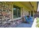 Relaxing outdoor sitting area with brick accents and space for outdoor dining at 11471 Clarkston Rd, Zionsville, IN 46077