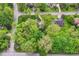 High-angle view of a home featuring mature trees, a landscaped yard, and surrounding foliage at 11550 Clarkston Rd, Zionsville, IN 46077