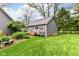 Backyard shed featuring neutral siding, a gray roof, and ample storage space at 11550 Clarkston Rd, Zionsville, IN 46077