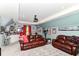 Spacious basement media room with comfortable leather seating and sports memorabilia at 11550 Clarkston Rd, Zionsville, IN 46077