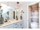 Updated bathroom features double sinks with modern faucets and a tiled shower and tub combination at 11550 Clarkston Rd, Zionsville, IN 46077