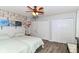 Bright bedroom with exposed brick, ceiling fan, two closets and two comfortable beds at 11550 Clarkston Rd, Zionsville, IN 46077