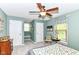 Serene bedroom featuring a ceiling fan, painted walls, comfortable decor, and natural light at 11550 Clarkston Rd, Zionsville, IN 46077