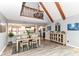 Dining area with view to the kitchen, chandelier, and decorative console table at 11550 Clarkston Rd, Zionsville, IN 46077