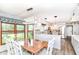 Eat-in kitchen featuring white cabinets, stainless steel appliances, and a dining table at 11550 Clarkston Rd, Zionsville, IN 46077
