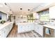 Bright kitchen with white cabinets, stainless steel dishwasher, and elegant countertops at 11550 Clarkston Rd, Zionsville, IN 46077