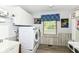 Functional laundry room with washer and dryer and built in shelving at 11550 Clarkston Rd, Zionsville, IN 46077