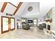 Bright living room featuring vaulted ceilings, fireplace and sunlit french doors at 11550 Clarkston Rd, Zionsville, IN 46077