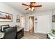 Comfortable office with neutral walls, ceiling fan, and carpeted flooring at 11550 Clarkston Rd, Zionsville, IN 46077
