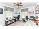 Bright office space with dual work areas, natural light, and a ceiling fan at 11550 Clarkston Rd, Zionsville, IN 46077