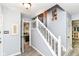 Neutral foyer with a staircase and white trim, providing an inviting entrance at 11550 Clarkston Rd, Zionsville, IN 46077