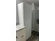 Bathroom storage cabinet features modern hardware and fixtures, and is connected to the bathroom vanity at 1202 S Ribble Ave, Muncie, IN 47302