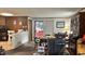 Cozy living space with dining area, featuring wood paneling and a glimpse of the kitchen at 1202 S Ribble Ave, Muncie, IN 47302
