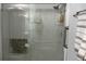 This stand-up shower features glass doors and chrome fixtures, as well as some decorative items at 1202 S Ribble Ave, Muncie, IN 47302