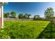 Lush backyard features a well-manicured lawn, framed by a wooden fence at 1221 Danielle Rd, Lebanon, IN 46052