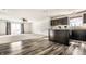 Finished basement featuring a bar area, modern flooring, and a sliding door to the backyard at 1221 Danielle Rd, Lebanon, IN 46052